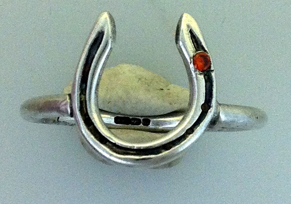 solid silver horseshoe ring on sterling silver band with stone in stud hole handmade at www.lrsilverjewellery.co.uk