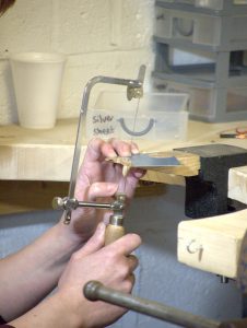 sawing silver on the basic silversmithing course with LR silver jewellery to make a ring or bangle from sterling silver wire. Book at www.lrsilverjewellery.co.uk