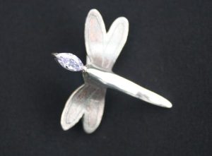 close up of the marquise stone on the solid silver dragonfly brooch made as part of the silver clay brooch course at www.lrsilverjewellery.co.uk