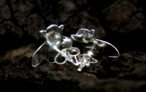 The back of two sterling silver bee studs