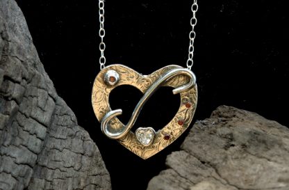 The front of a sterling silver heart necklace
