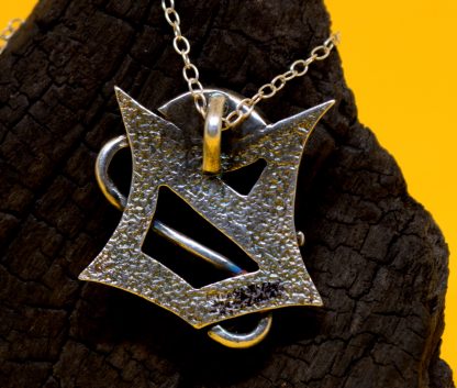The back of a sterling silver shield necklace